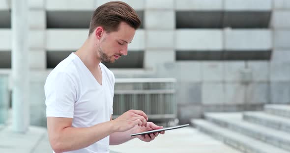 Young man looking at tablet computer