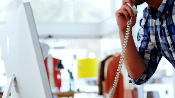 Male executive talking on phone