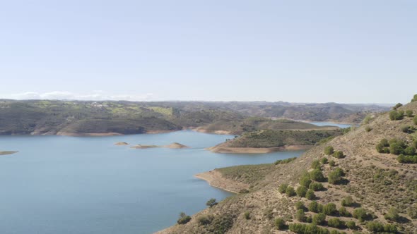 Aerial drone view of Barragem de Odeleite Dam reservoir in Alentejo, Portugal