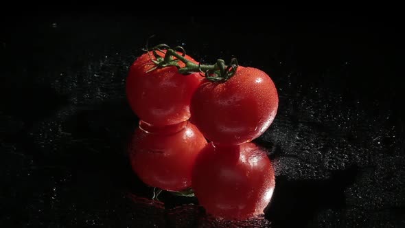Two Red Tomatoes on Dark Background Close-up and Master Shot
