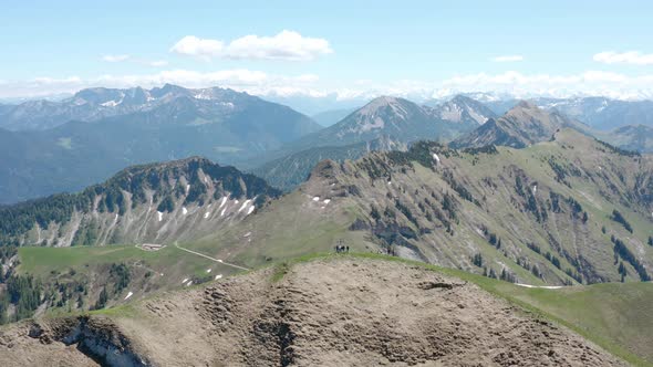 View of summit cross and hikers, Achenkirch, Austria