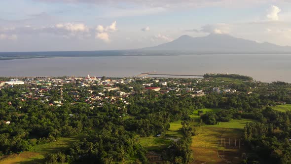 View of a Small Town and a Volcano in the Distance, Sorsogon City, Luzon, Philippines, Summer