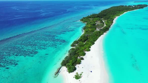 Aerial flying over landscape of relaxing bay beach time by blue green lagoon and clean sandy backgro