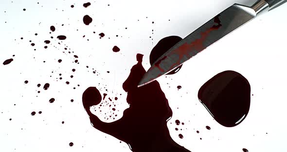 Knife with Blood against White Background, Slow Motion