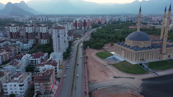 Aerial View of City Buildings and Street with Driving Cars