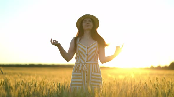 Girl Throws a Straw Hat at the Camera