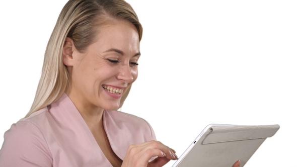 Smiling businesswoman using a tablet computer on white background.