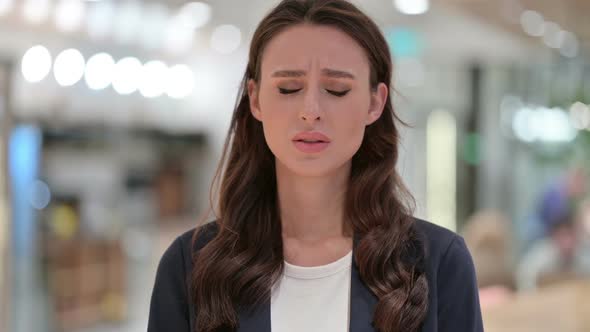 Portrait of Sad Businesswoman Looking at Camera