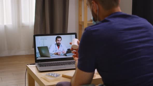 Man Listening His Doctor on Video Call