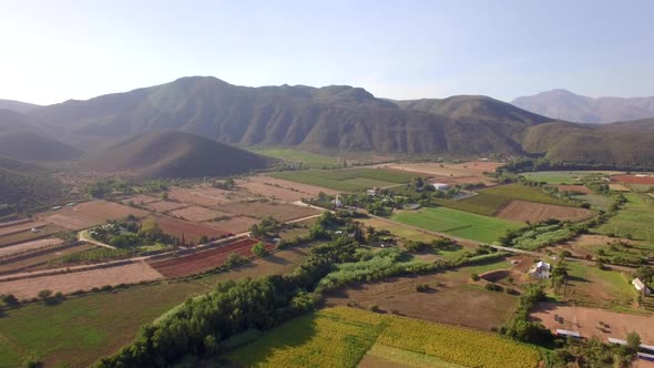 Aerial travel drone view of farms and farming.