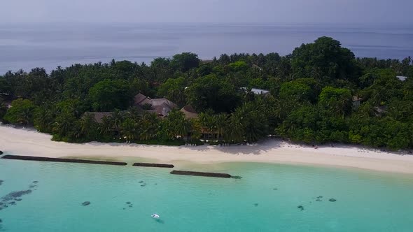 Drone tourism of coastline beach by blue water and sand background