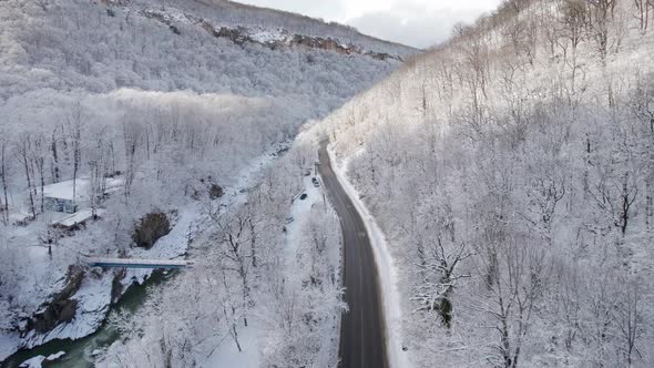 Aerial View of Plateau LagoNaki Mountain Twisted Road in the Winter and Driving Car