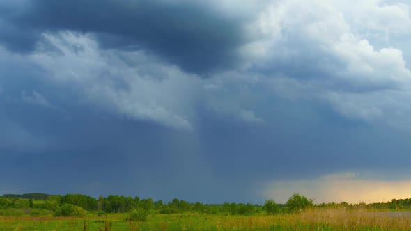 Storm Clouds Are Moving Over Countryside Field