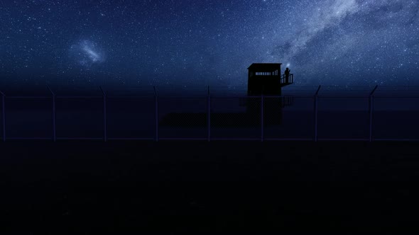 Soldier Watching the Military Watchtower at Night