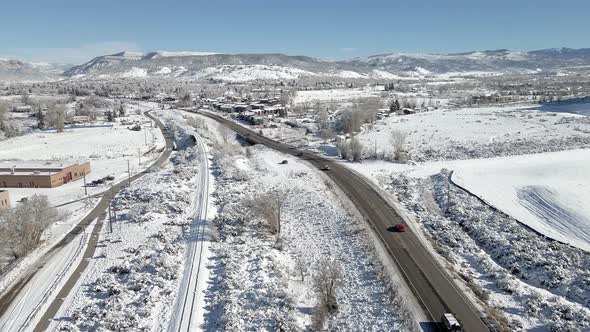 Flying along the road towards the town of Eagle in December with a fresh layer of snow. Filmed in th