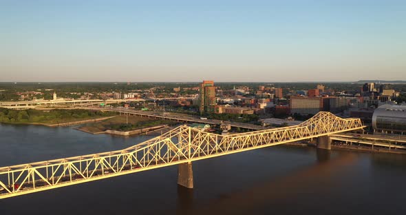 Bridge in Louisville, Kentucky over Ohio River with drone video moving down.