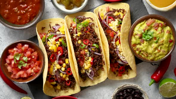 Tasty Mexican Meat Tacos Served with Various Vegetables and Salsa