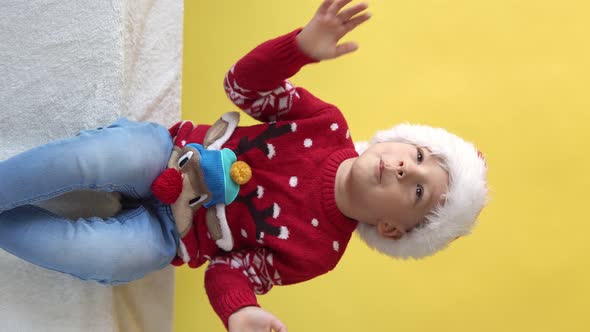 Vertical Portrait Emotion Cute Cheerful Funny Preschool Baby Boy Laughing Fooling Around In Santa