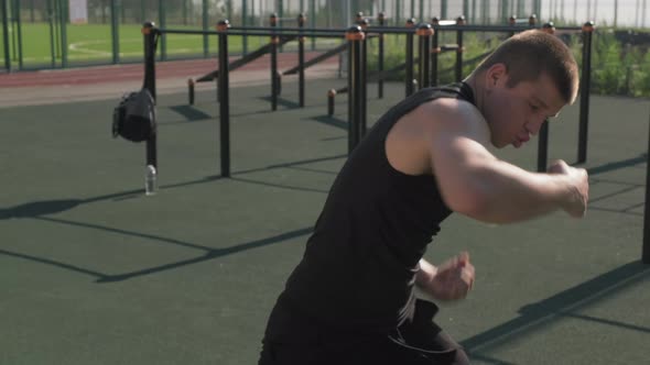 Sportsman Practicing Boxing Punches