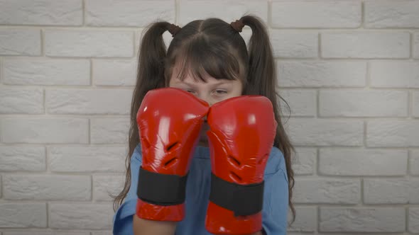 Child Fighting in Gloves