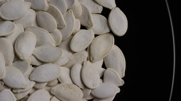 Cinematic, rotating shot of pumpking seeds - PUMPKIN SEEDS 025