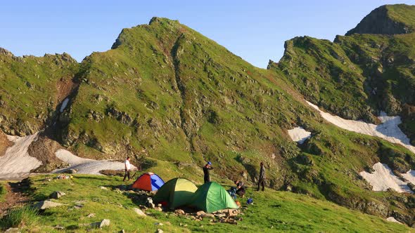 Time Lapse with the View of the Huge Mountain and Colorful Camping Tents