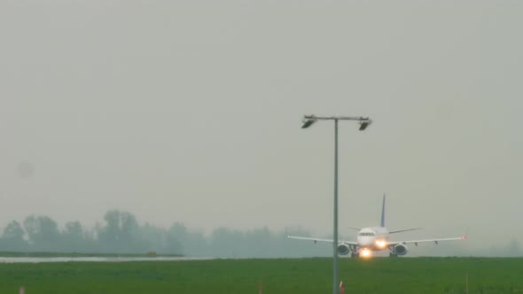 Jet Airplane Departure at Rain