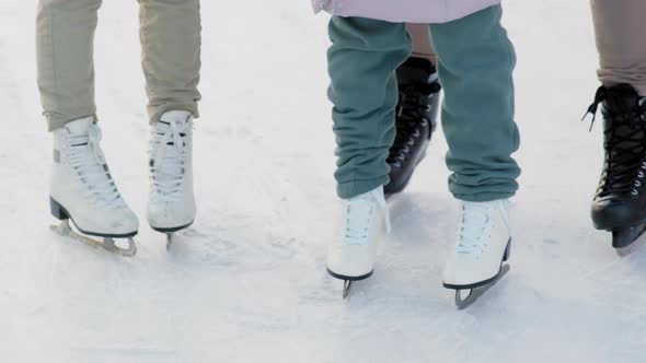 Legs In Skates On Ice Rink