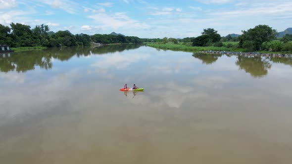 Couple Men and Women in Kayak on the River Kwai in Thailand