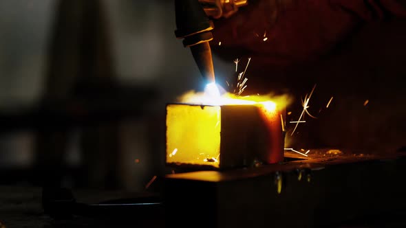 Welder welding a metal