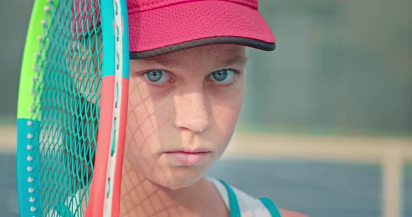 Focus of a Cute Female Tennis Player Wearing Fuchsia Cap