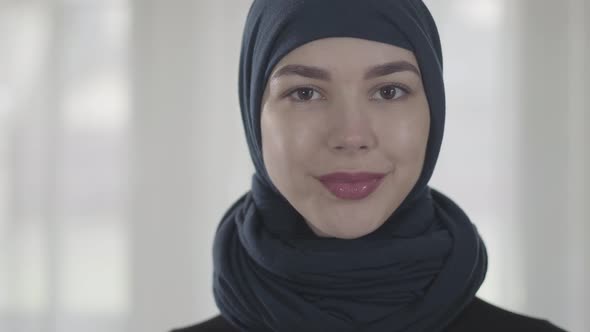 Portrait of Independent Young Muslim Woman Looking Serious Confident at Camera Wearing Traditional