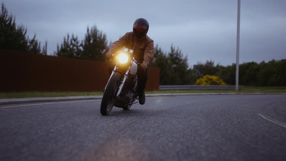 MotorcycleRiding on a Roundabout Under the Gray Skies