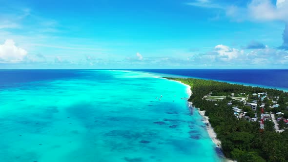 Aerial flying over seascape of paradise coast beach voyage by blue green sea with clean sandy backgr