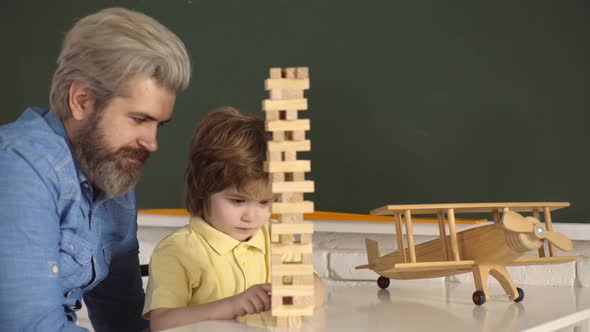 Father and Son Happy Family Playing Board Game at Home, Happiness Childhood Concept.