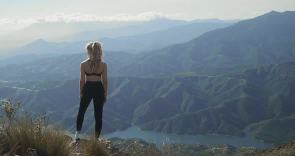 Woman Looking At Dramatic Landscape Of La Concha Before Walking Away