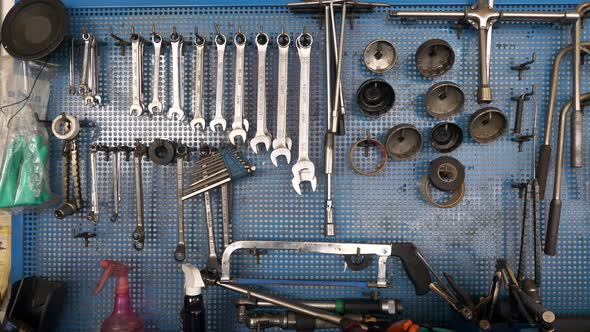 Tool Supplies for Car Maintenance or Machine Hanging on Wall at Garage