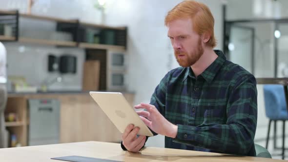 Loss Beard Redhead Man Reacting to Failure on Tablet