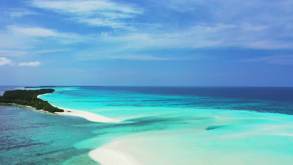 Natural aerial travel shot of a white sandy paradise beach and blue ocean background in high resolution