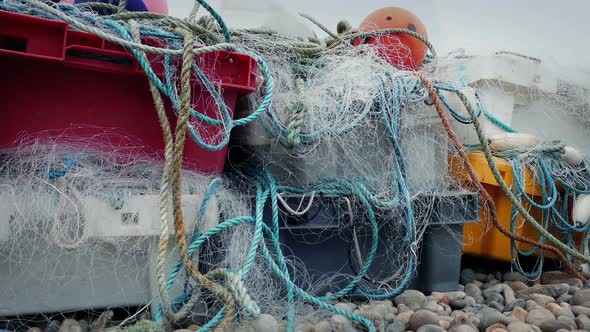 Fishing Nets And Ropes In Pile On The Beach