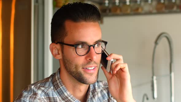 Handsome man talking on mobile phone