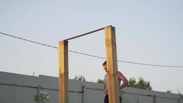 Sports Man Performing Muscle Up