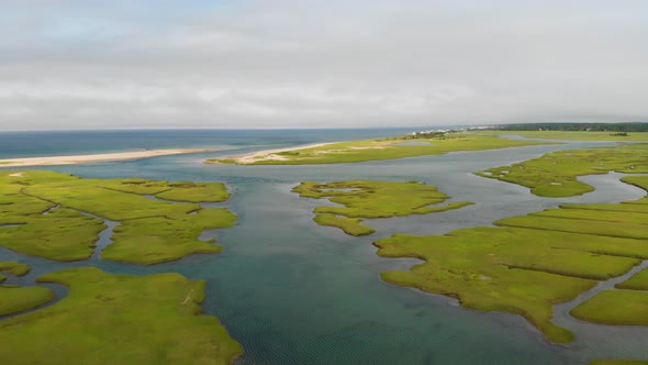 Cape Cod Bay Aerial Drone Footage of Bay Side Marsh headed towards Springhill Beach.