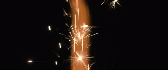 Fire and orange sparks coming out of a firework