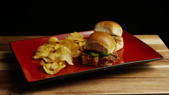 Rotating shot of delicious pulled pork sliders - BBQ