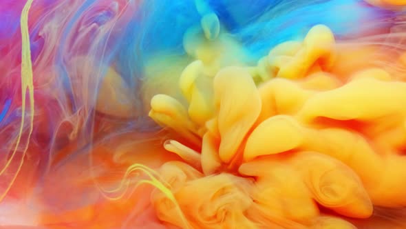 Ink in Water Exploding Mixing in Slow Motion. Paint Splash Swirling Underwater. Colorful Clouds