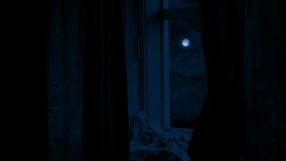 Moon And Clouds Through Window Of Old Derelict Building