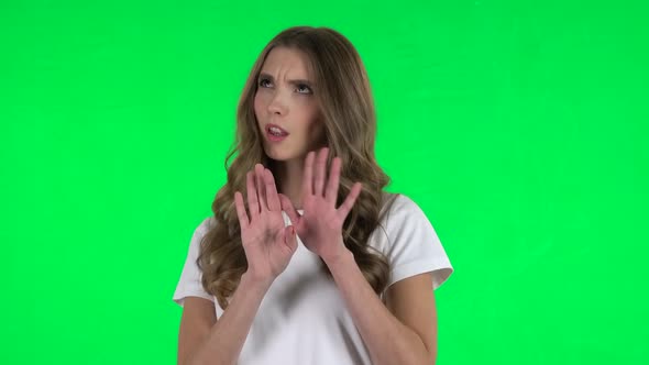 Lovable Girl Negatively Waving Her Head Expressing She Is Innocent. Green Screen