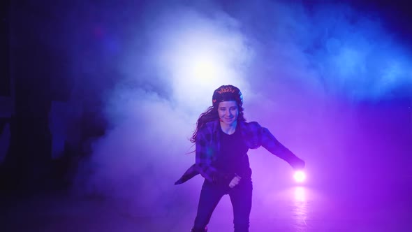 Pretty Smiling Purposeful Brunette Girl with Long Hair in Helmet and Protection Riding Roller Skates