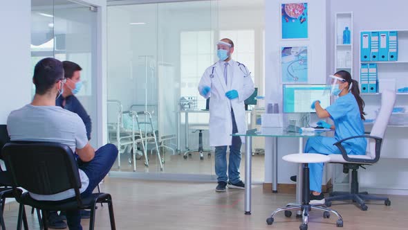 Nurse Measuring Temperature in Private Hospital